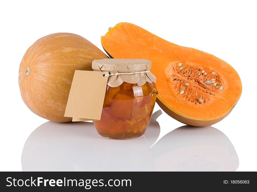 Jar with sweet of pumkins isolated on white background