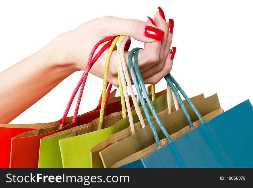 Female hands hold colorful shopping bag. Female hands hold colorful shopping bag.