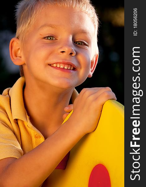 Portrait of smiling little boy - golden light