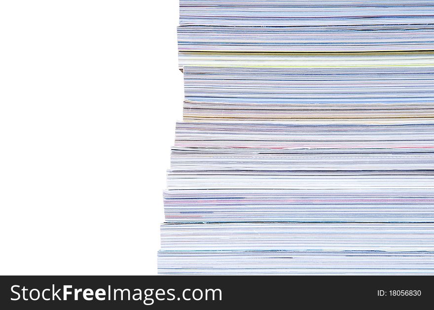 Isolated large heap of magazines with colourful pages