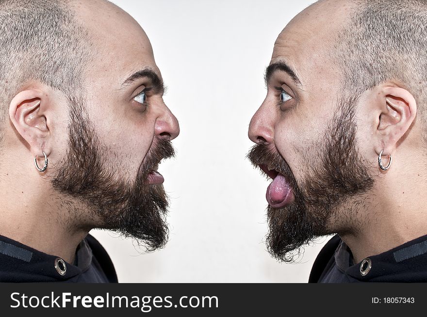 Two men with beards make grimaces on white background