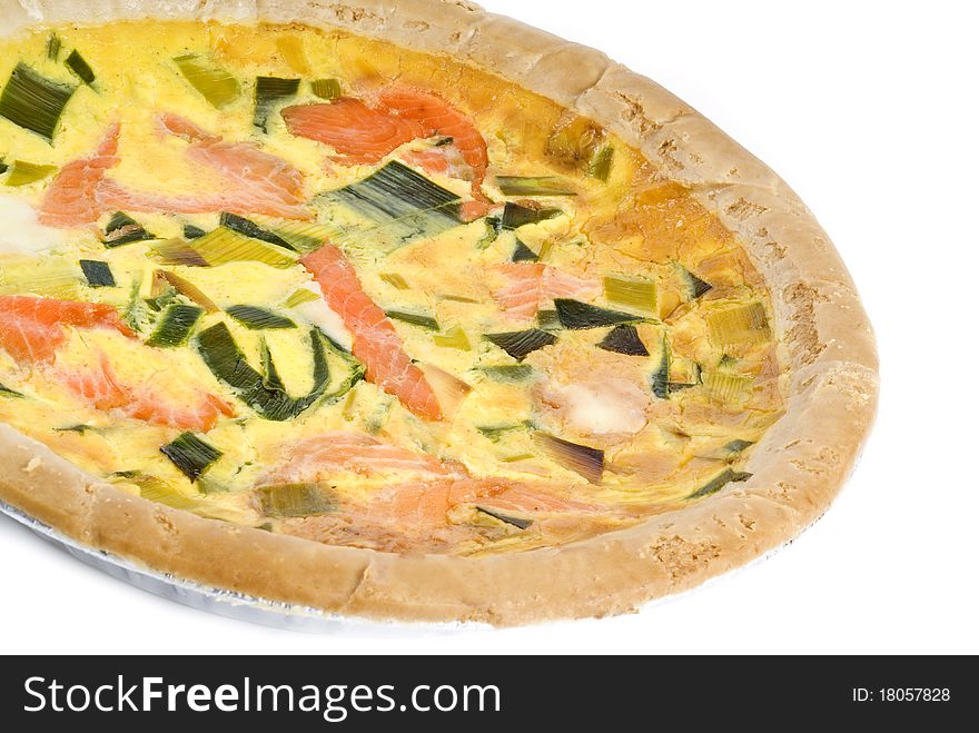 Colorful baked salmon quiche isolated on white.