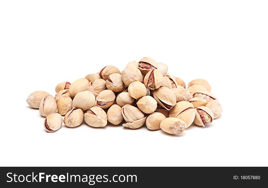 Heap of pistachios nuts on a white background. Heap of pistachios nuts on a white background.