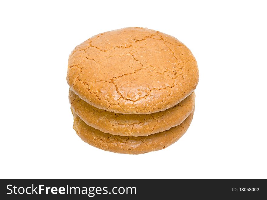 Three almond cakes are combined by a pile. On a white background