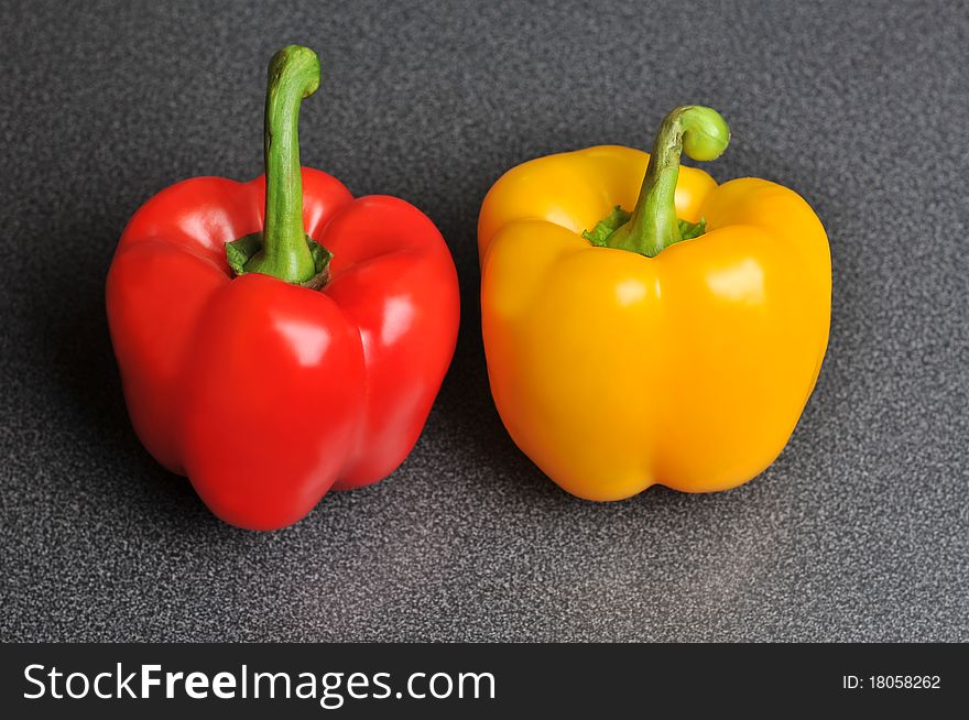 Two Peppers On A Kitchen Table