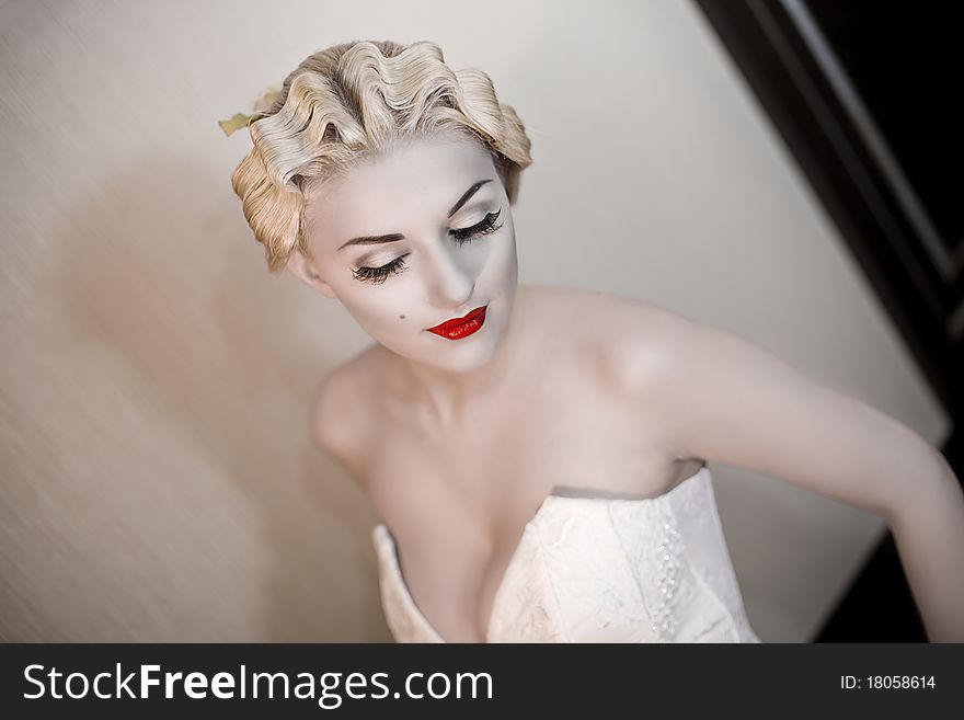 Fashion portrait of young beautiful woman with red lips