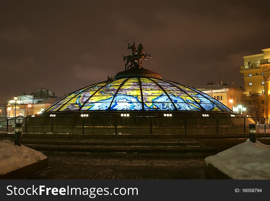 Glass cupola crowned by a statue