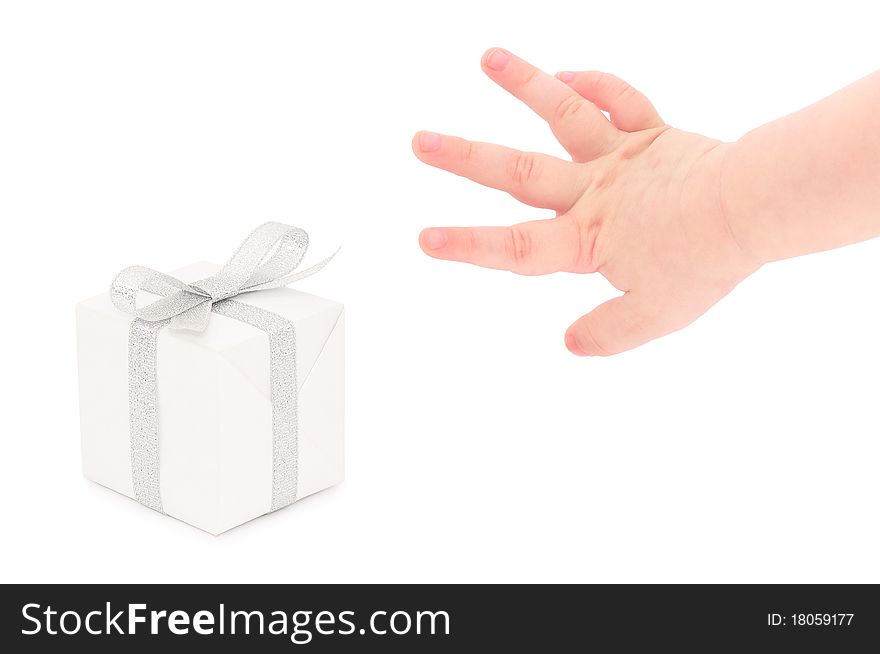 A child's hand taking a gift.  Isolated on white.