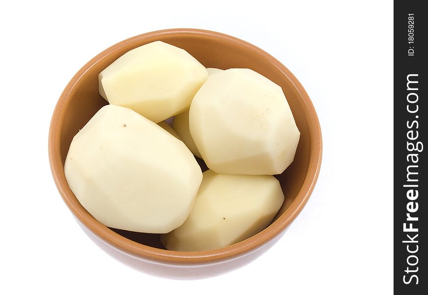 The a little well cleared potatoes are located in a plate which is on a white background. The a little well cleared potatoes are located in a plate which is on a white background