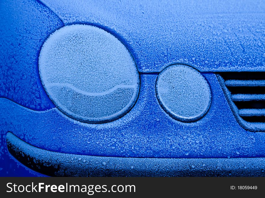 Ice on a blue car during winter season, good for concepts. Ice on a blue car during winter season, good for concepts