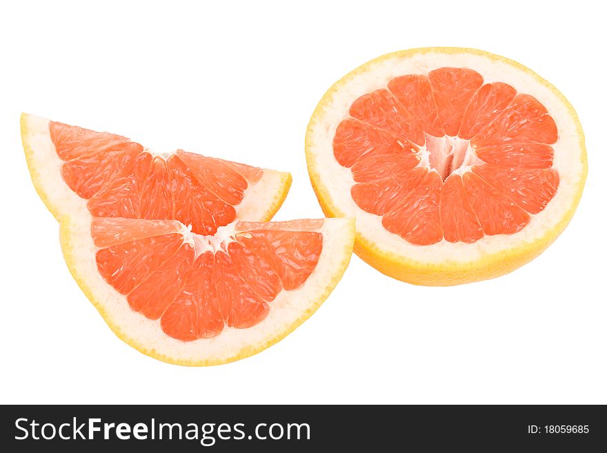 Close-up peaces of red grapefruit, isolated on white