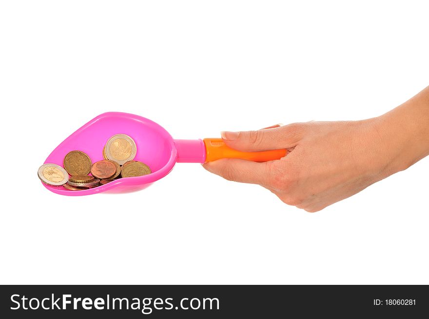 Woman holding a Children's shovel with euro coins as a symbol of the beginning of small business growth