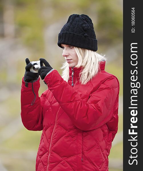 Young lady taking photos outdoors. Young lady taking photos outdoors