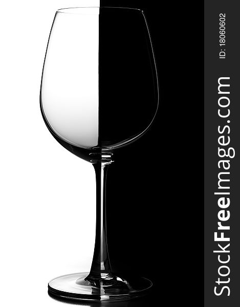 Empty wine glass on black and white background.