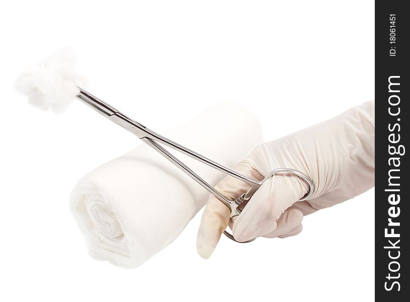 Surgical instrument in the hand of a physician and a bandage on a white background