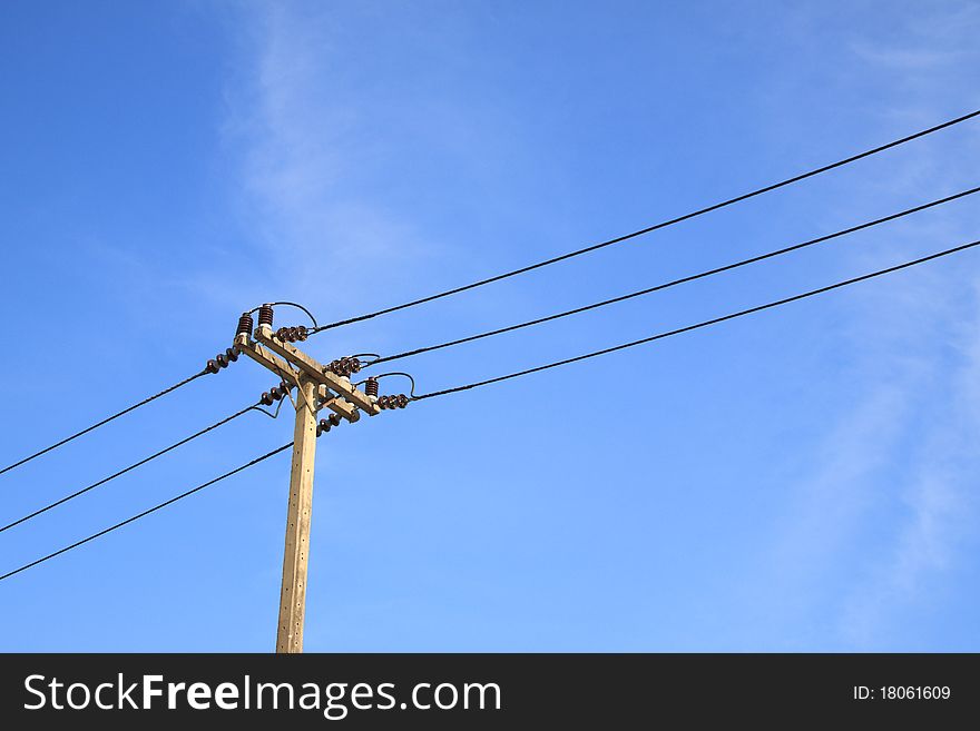 Electric pole in blue sky