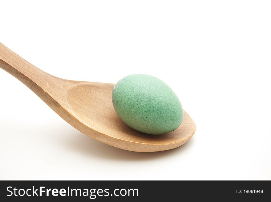 Colored egg onto wooden spoons. Colored egg onto wooden spoons