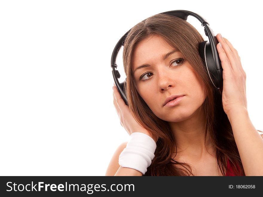 Brunette young woman listening music big headphones and thinking isolated on white background. Brunette young woman listening music big headphones and thinking isolated on white background