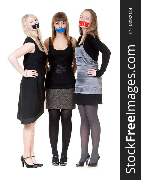Three beautiful girls with their mouths taped with scotch. Three beautiful girls with their mouths taped with scotch