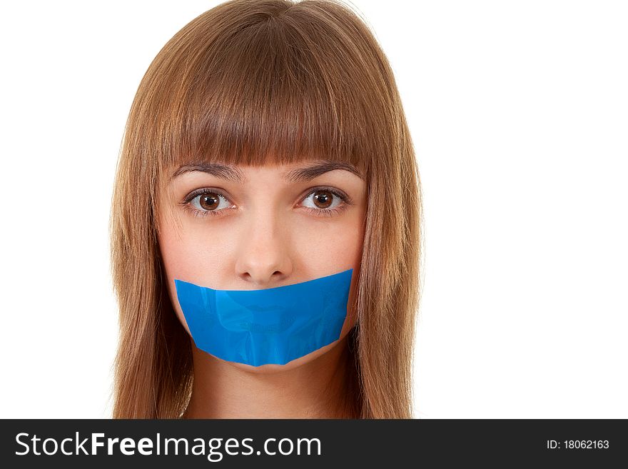 Beautiful girl with her mouth sealed with blue tape