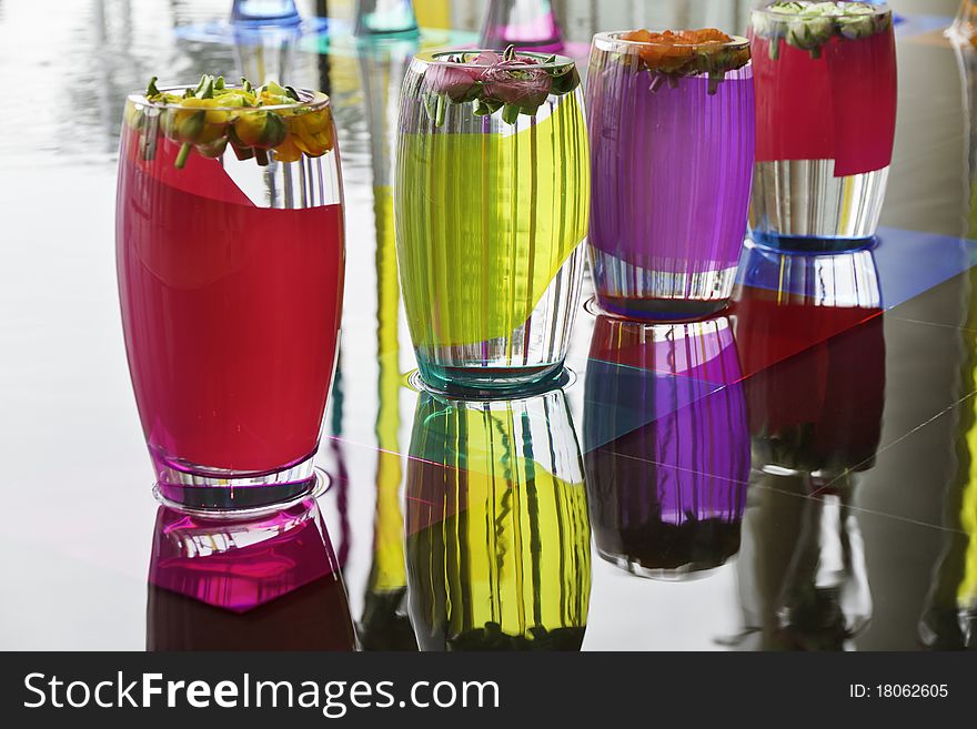 Photo of flowers in colorfoul vases