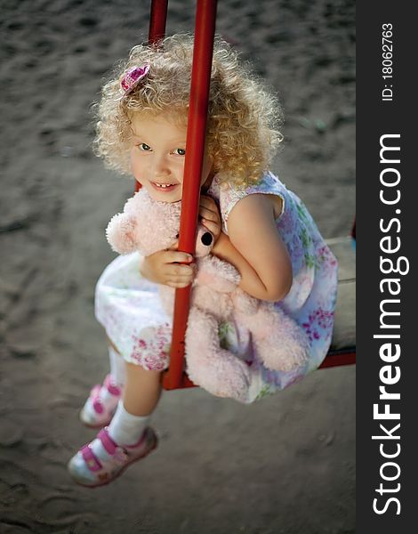 Little girl on the swing.