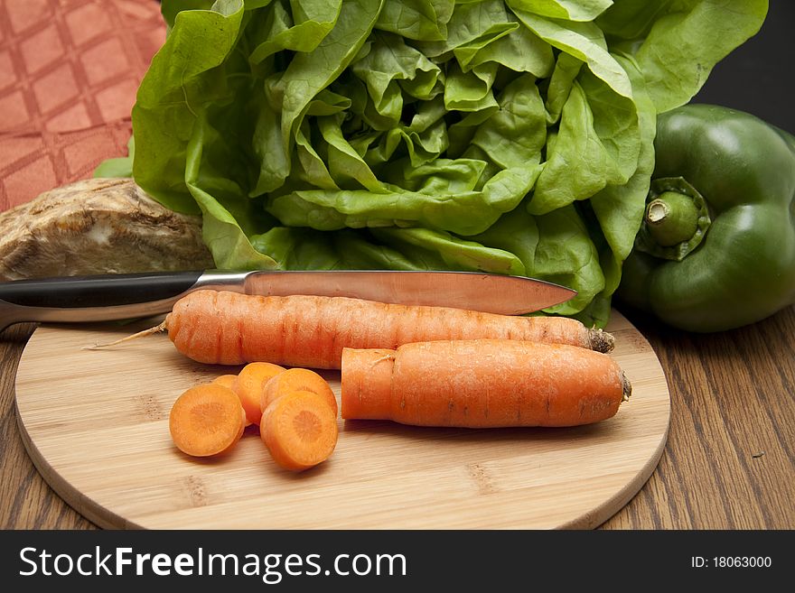 Cut carrot and salad with paprikas