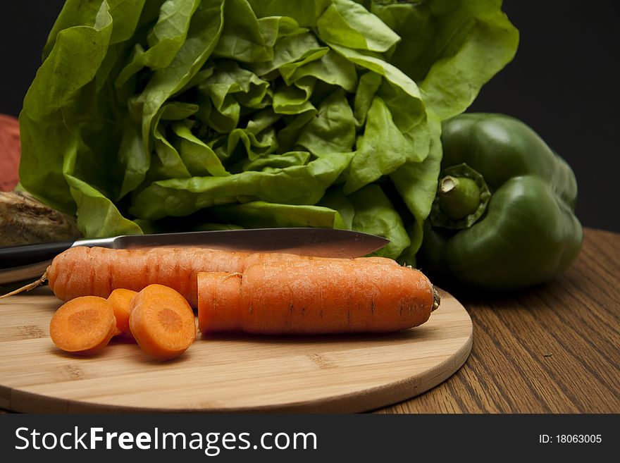 Cut carrot and salad with paprikas