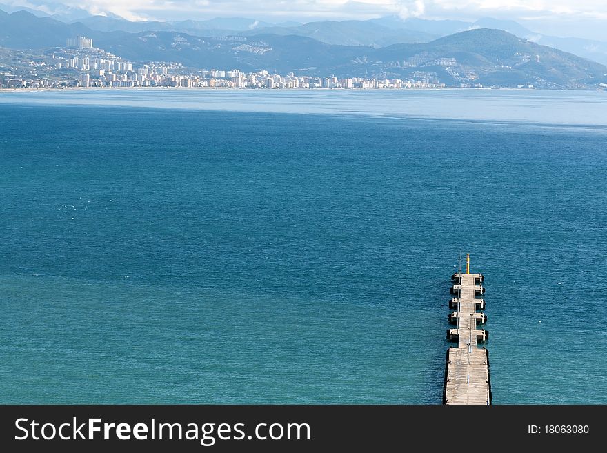 Pier into the sea and mountain views and Alanya