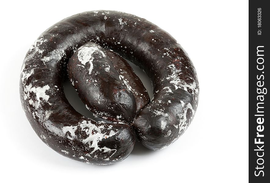 Frozen blood sausage ring on a white background
