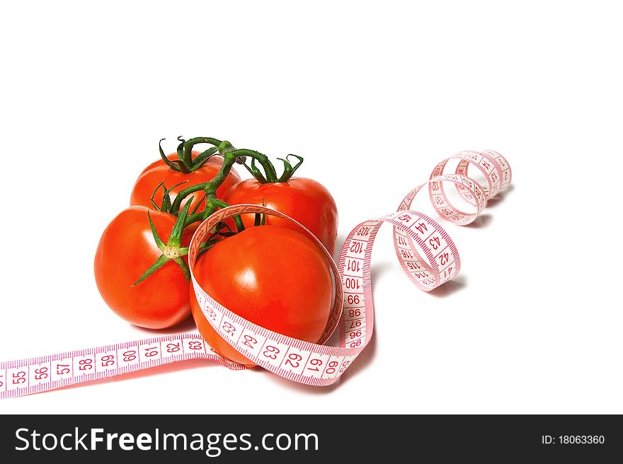 Tomato and tape measure isolated over white. Tomato and tape measure isolated over white