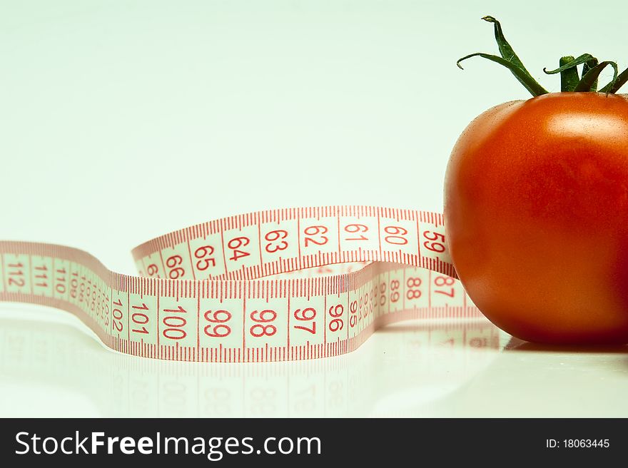 Tomato and tape measure in blye. White balance is incorrect