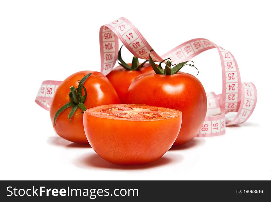 Tomato and tape measure isolated over white