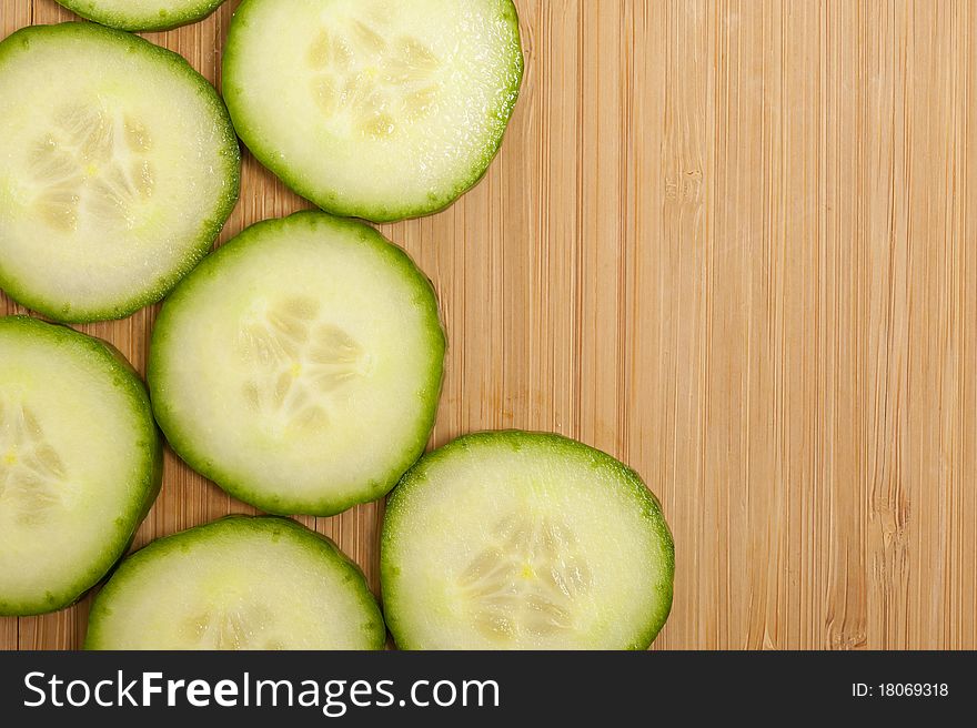 Vegetarian background with fresh green cucumber . Healthy vegetable