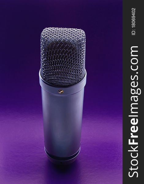 Studio microphone on a violet background