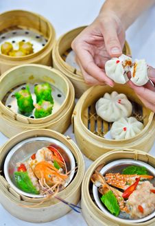 Steamed Dumpling And Dimsum With Hand Stock Photo Steamed Dumpling And Dimsum With Hand Stock Photo