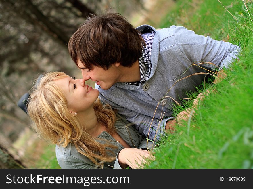 Young cheerful couple in the park