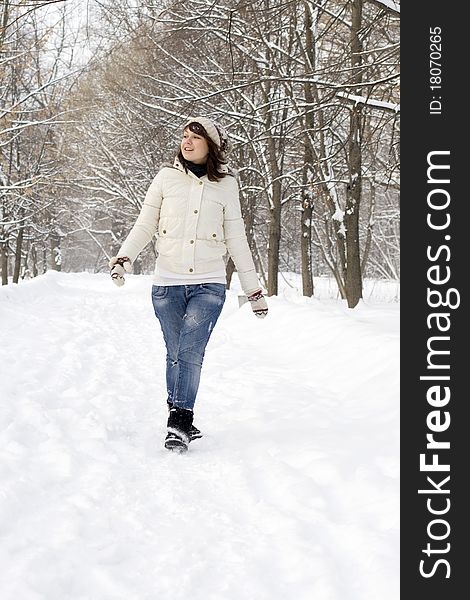 Beautiful girl walking in winter forest. Beautiful girl walking in winter forest