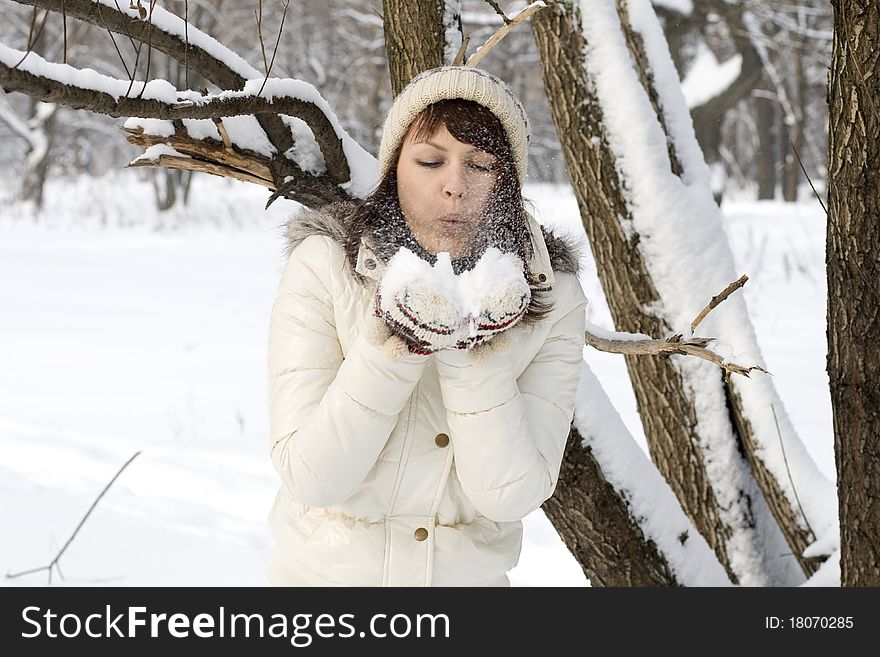 Cute girl walking in winter forest