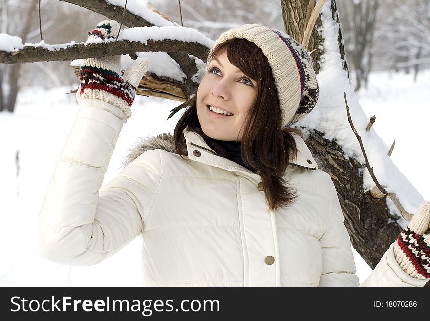 Cute girl walking in winter forest