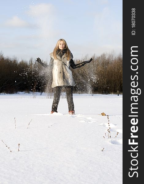 Girl walking in winter field