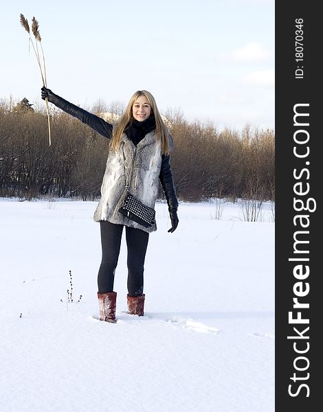 Girl walking in winter field
