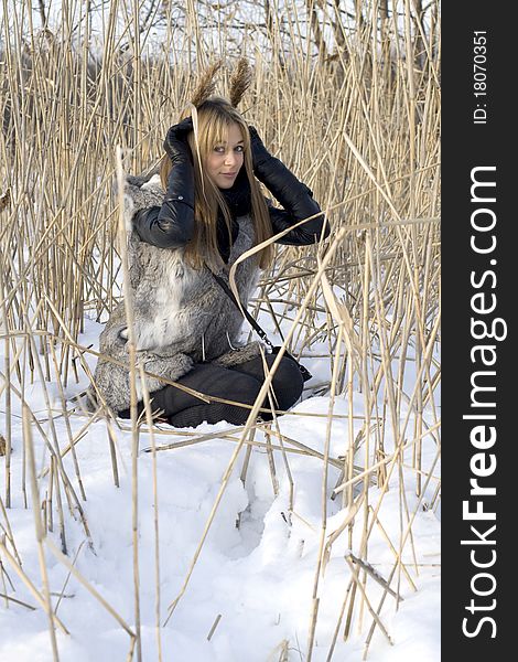 Girl walking in winter field