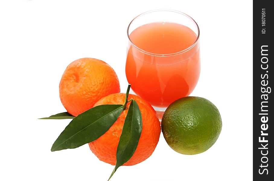 Glass of juice and citrus. Glass of juice and citrus