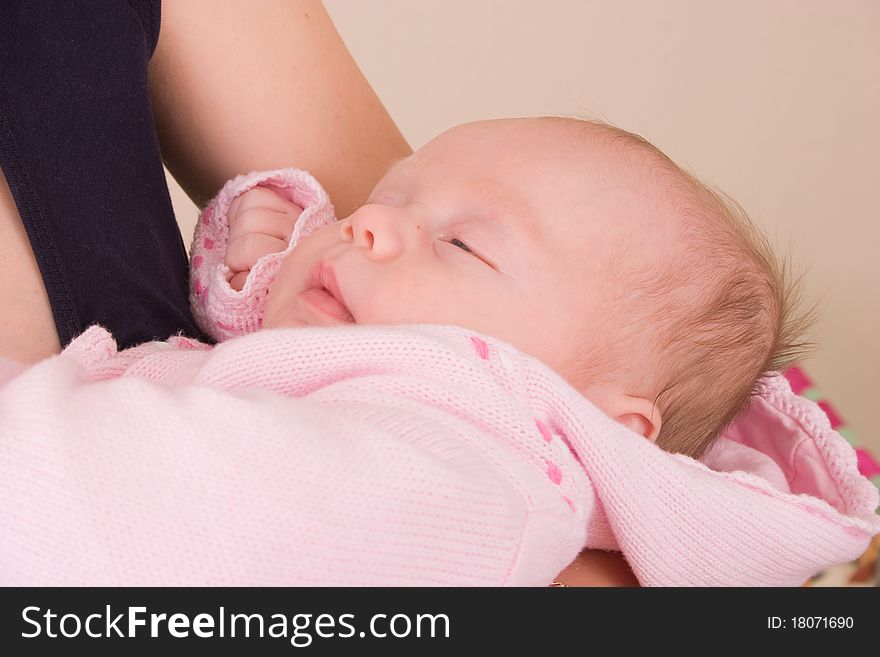 3 month old baby at mum on hands