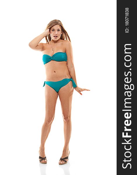 Young girl in teal bikini acting cute while playing with her hair, shot against a white background. Young girl in teal bikini acting cute while playing with her hair, shot against a white background.