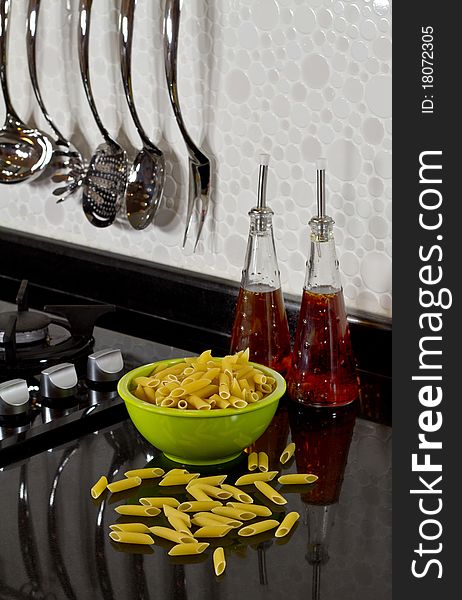 Background of modern kitchen and uncooked pasta