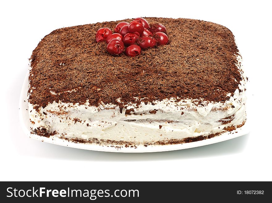Homemade cram cake with chocolate and cherries isolated over white