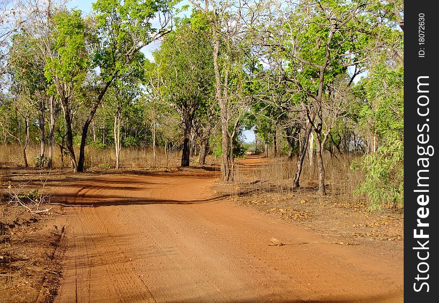 Gravelled road in the outback of Australia through the australian bush. Gravelled road in the outback of Australia through the australian bush