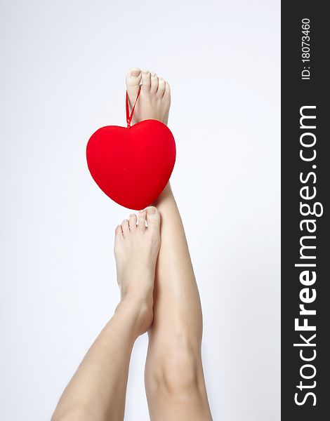 Portrait of young woman with red heart on white backgroun. Portrait of young woman with red heart on white backgroun